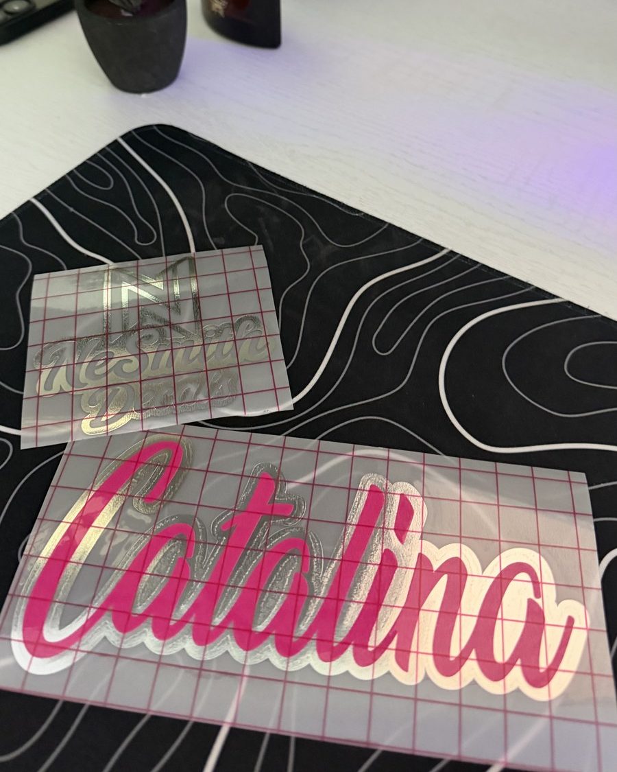 Hot pink script name decal with a chrome drop shadow, on transfer tape