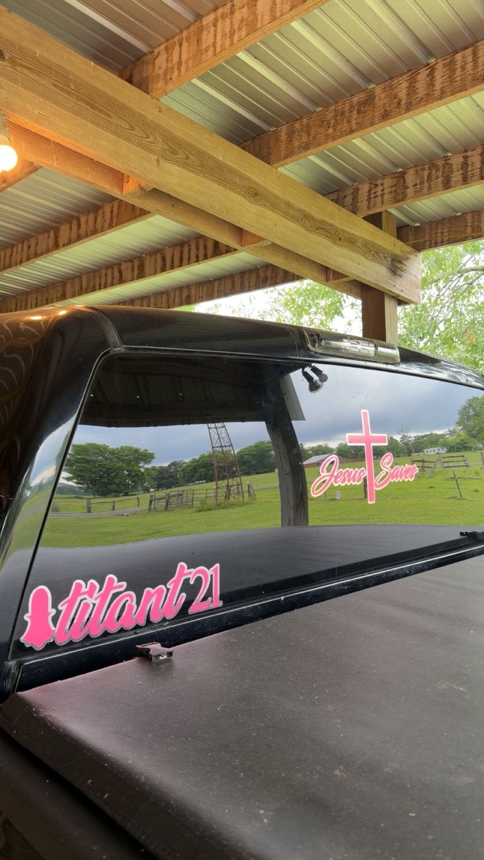 Pink name decal on truck back glass