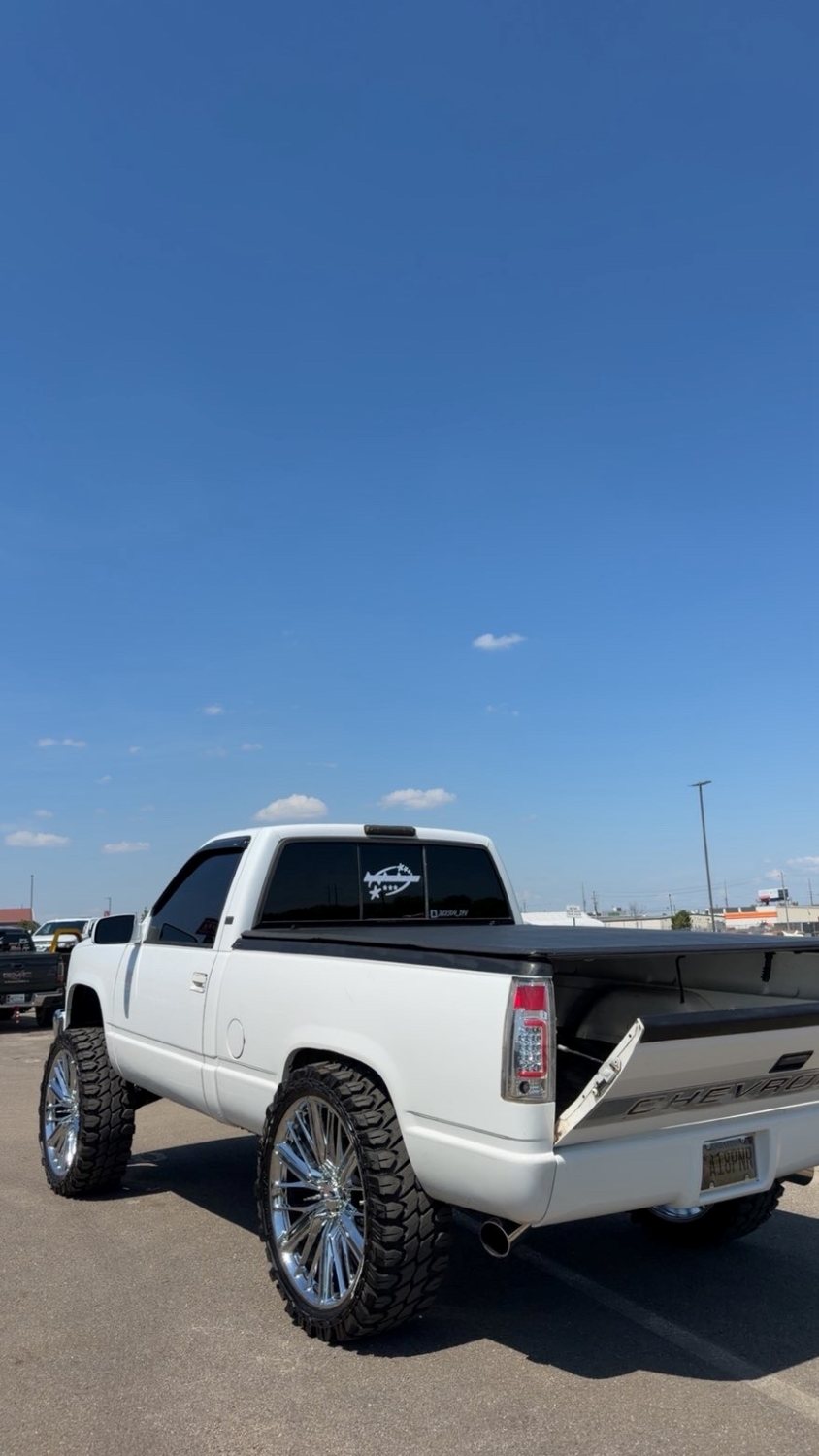 Back-glass decal on a clean white OBS Chevy on chrome wheels