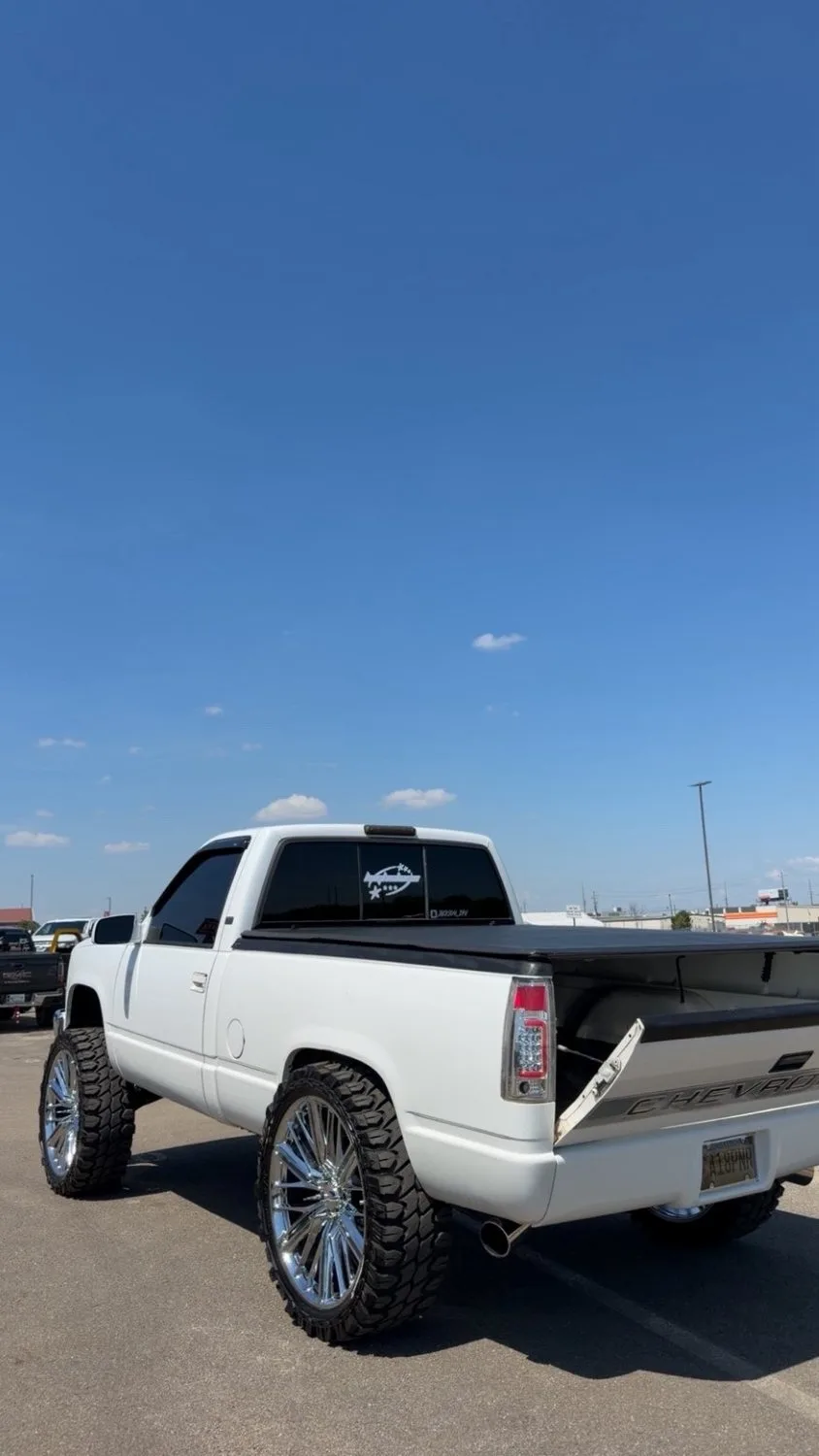 Back-glass decal on a clean white OBS Chevy on chrome wheels