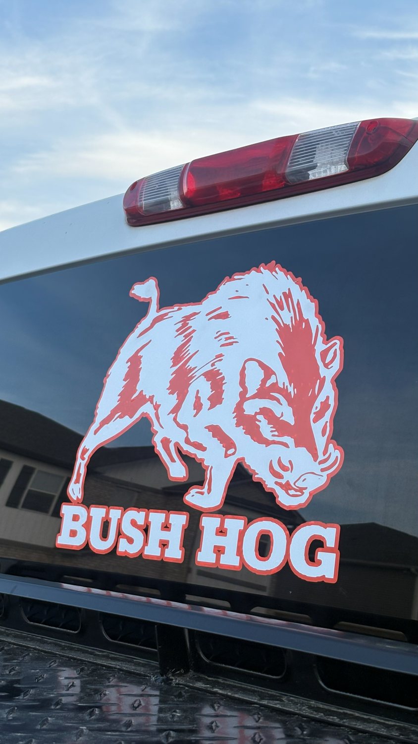 Bush Hog boar graphic decal on a truck tailgate