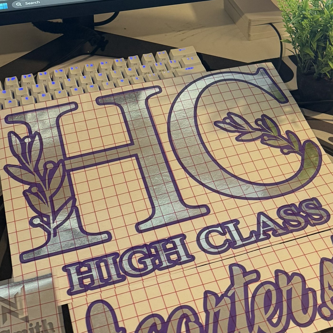 A chrome custom decal weeded and ready on the cutting mat